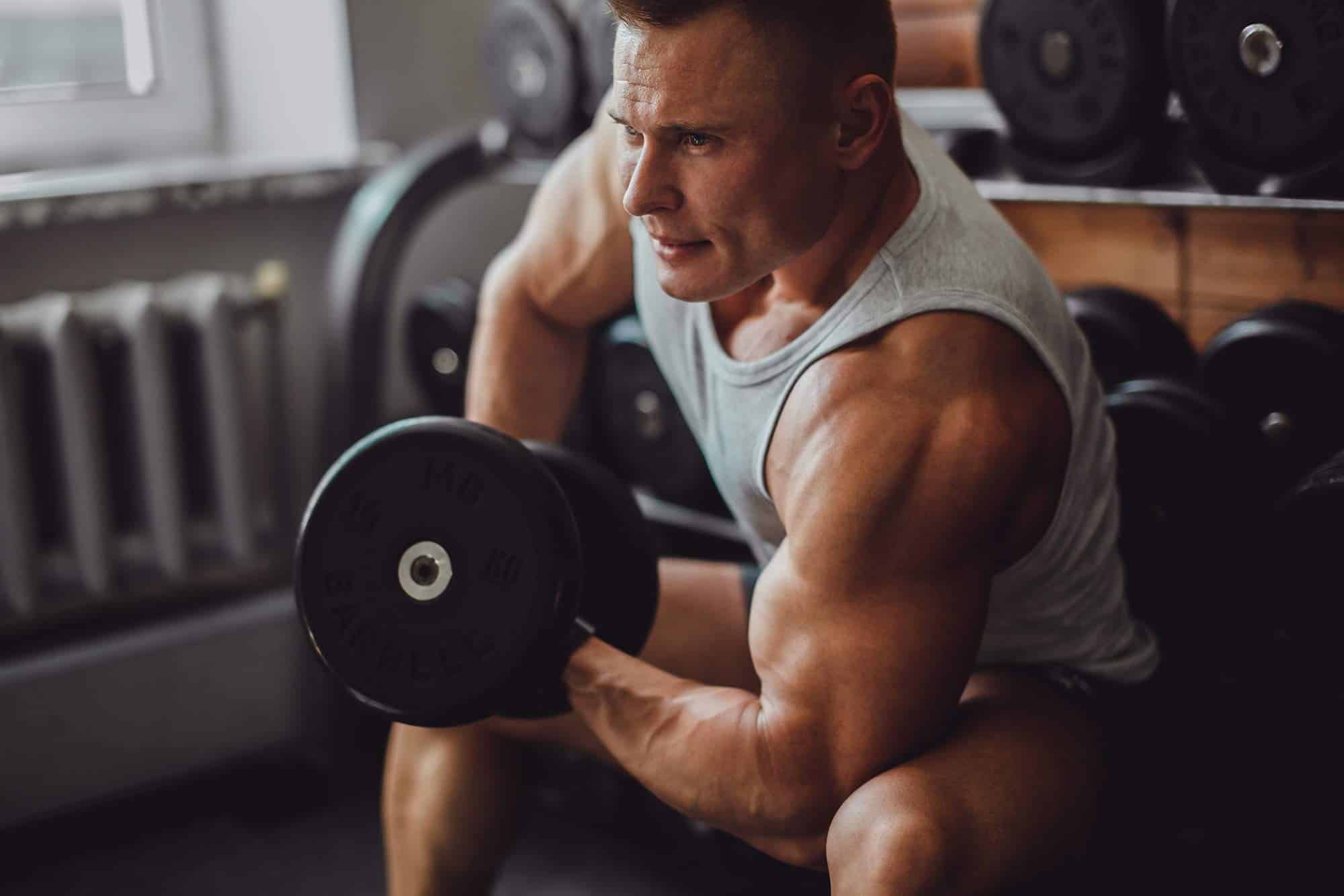 Muscular man doing a bicep curl