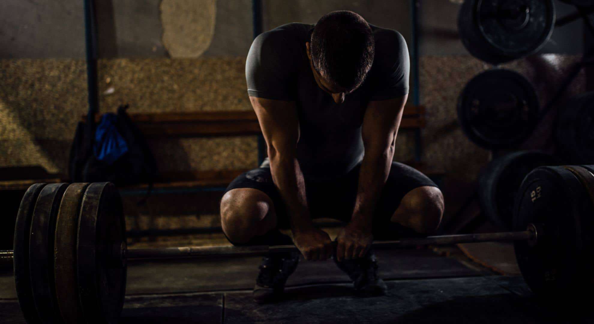 man weight lifting